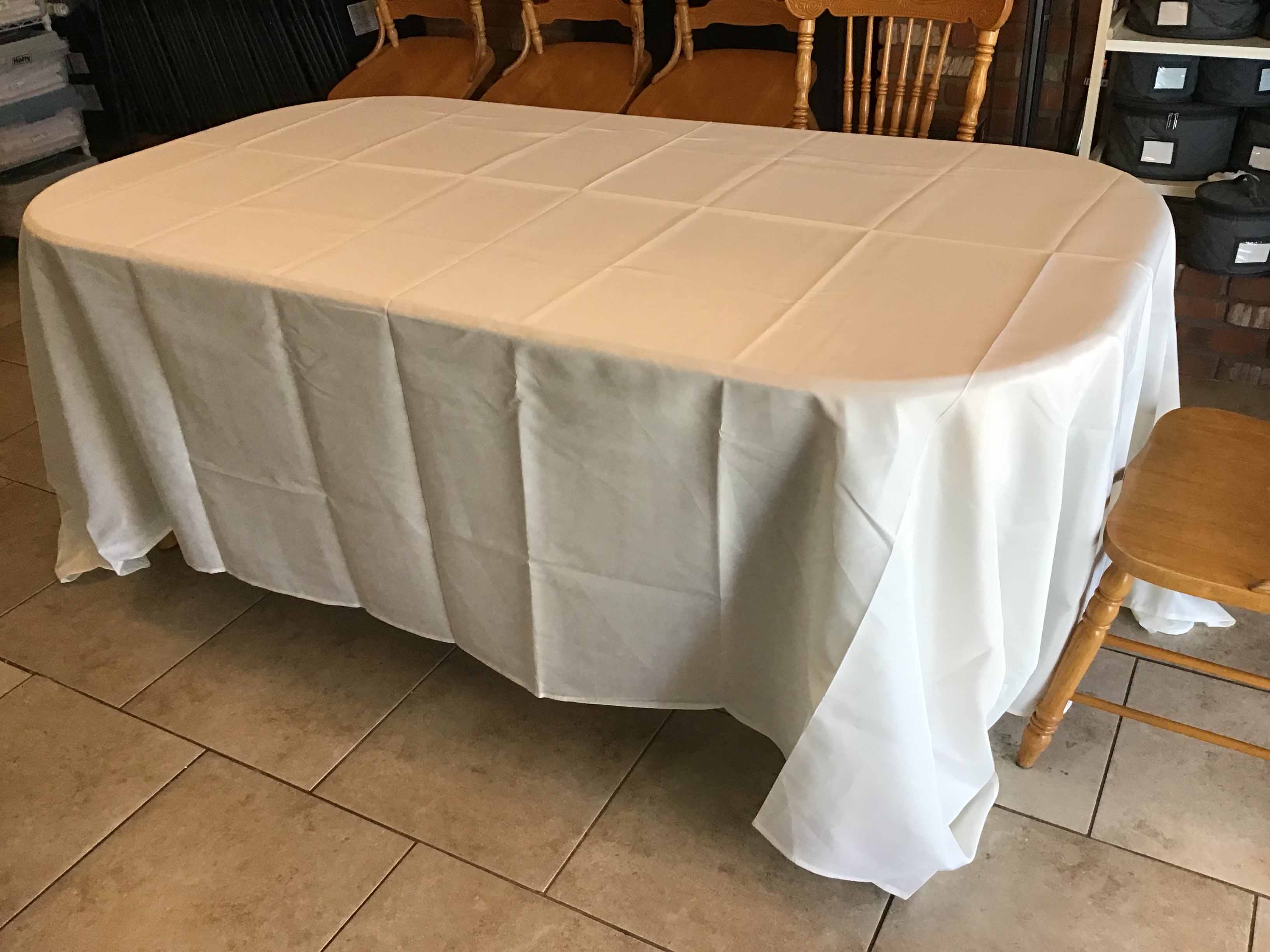 wrinkled tablecloth, fresh out of its original packaging on a table