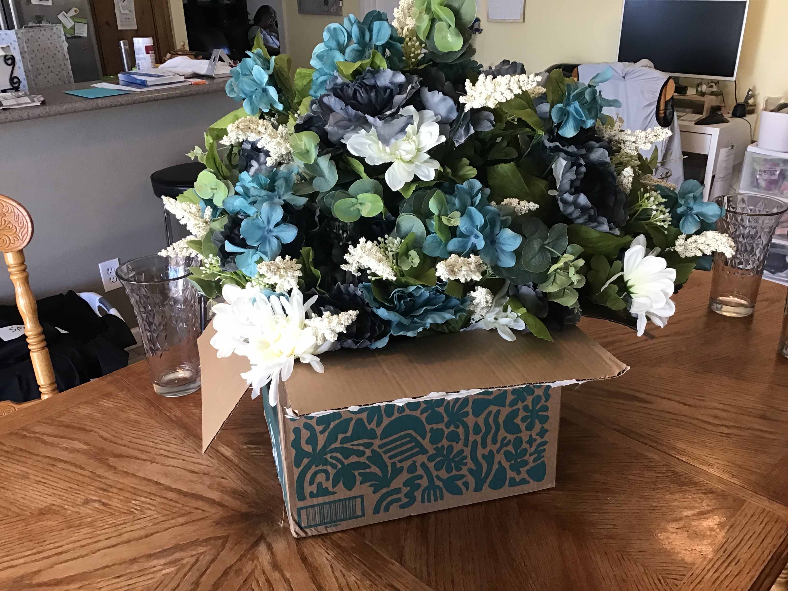box of plastic/silk flowers
