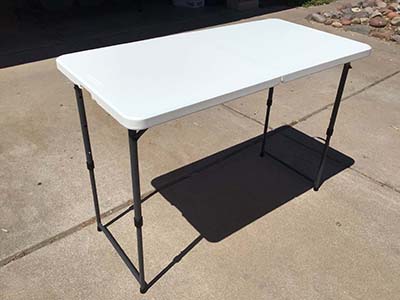 4 foot rectangle tables (adjustable heights)