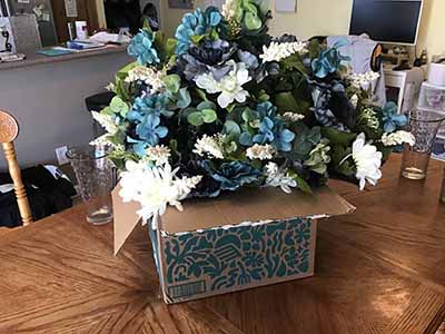 box of plastic/silk flowers